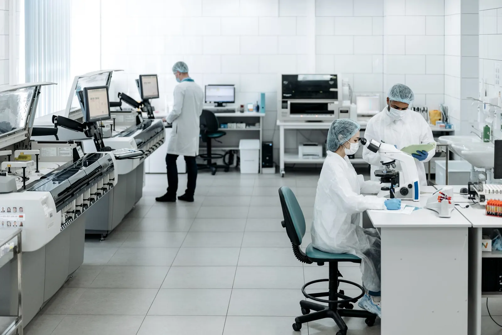 Scientists working with instruments in a bioanalytical laboratory